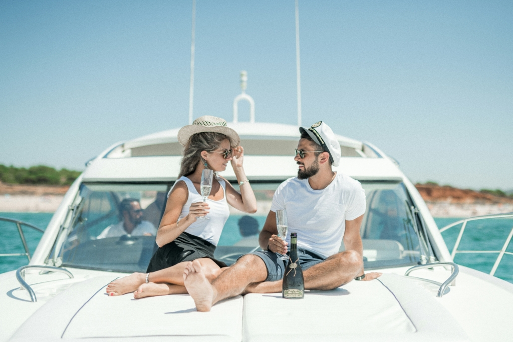 Successful business owners relaxing on a yacht, symbolising financial freedom and tax savings with expert accounting advice.